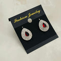 Ruby Teardrop Halo Studs